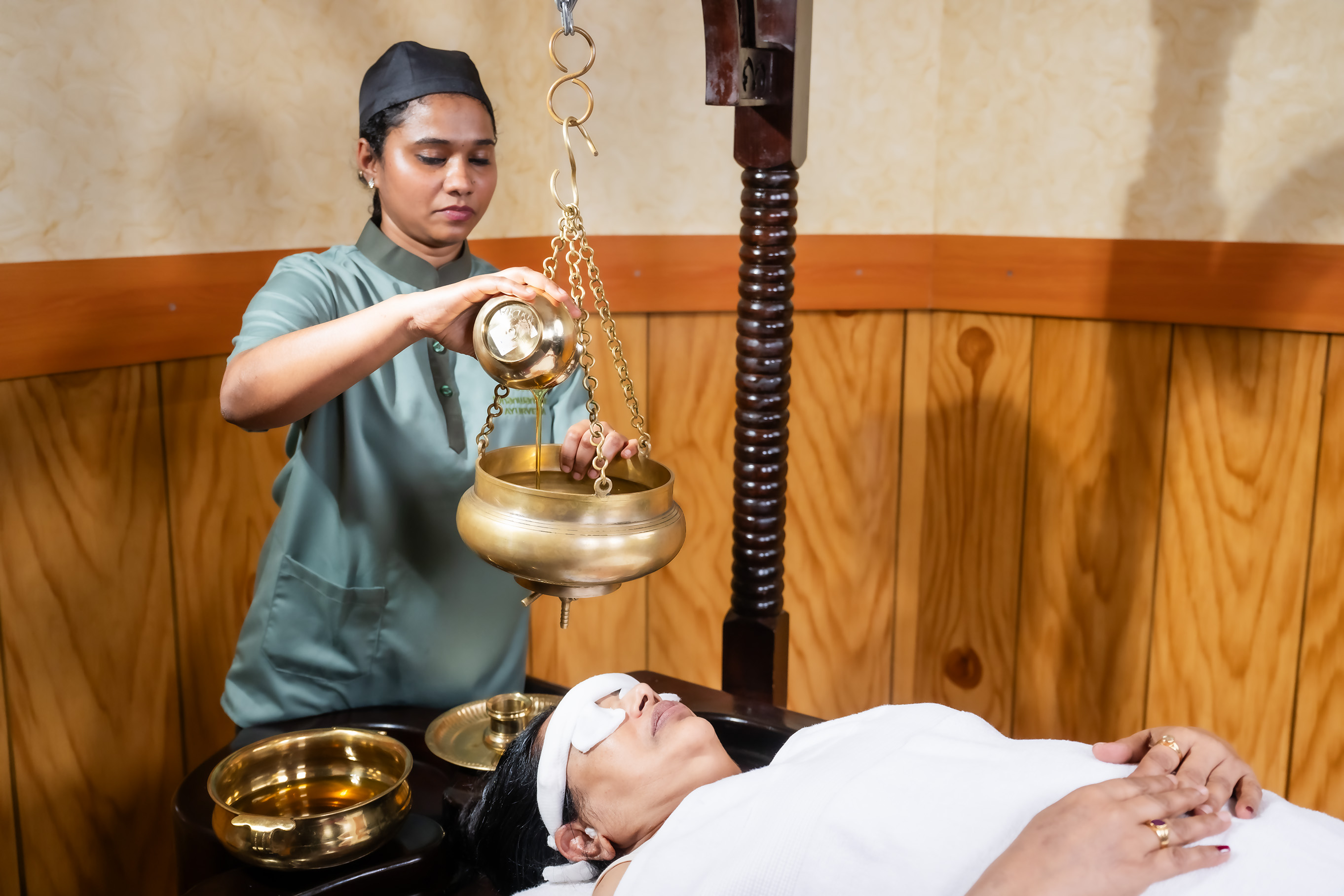 Thakradhara therapy in Dubai using medicated buttermilk for stress relief and mental relaxation